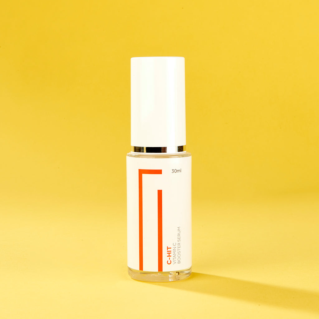 A bottle of GFYS C-Hit Vitamin C serum for acne, skin lightening, collagen, acne scars, antioxidant protection